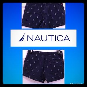 Blue nautica shorts with silver anchors.
